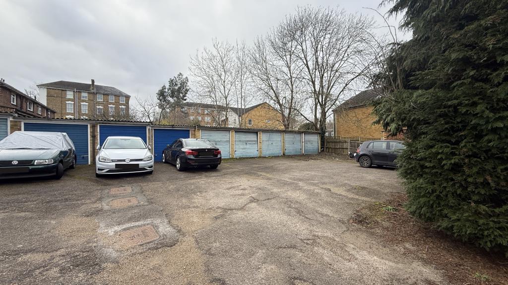 Lot: 144 - INVESTMENT FLAT IN POPULAR LONDON SUBURB - External image of garages in block